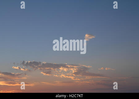sunset sunrise sun lit setting sun sky with clouds dramatic lighting inspirational, beautiful, serene, awesome, blue orange pink Stock Photo