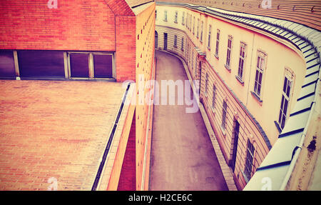 Purple toned high angle view of a narrow empty street in Vienna, Austria. Stock Photo