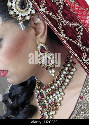 Asian wedding hands and jewelery, henna and gold Stock Photo