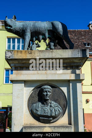 Capitoline Wolf statue with Romulus and Remus twins in Sighisoara city, Transylvania region in Romania Stock Photo