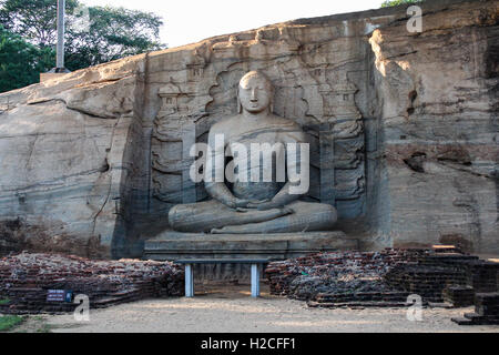 Seated Buddha Carved in Rock, Polonnaruwa, Sri Lanka Stock Photo