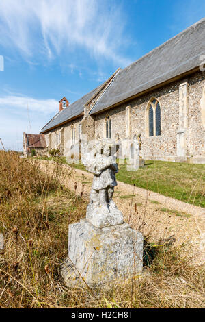 Praying cherub tombstone in St Peter's Westleton, a 14th century thatched church in the Suffolk Coastal District, east England Stock Photo