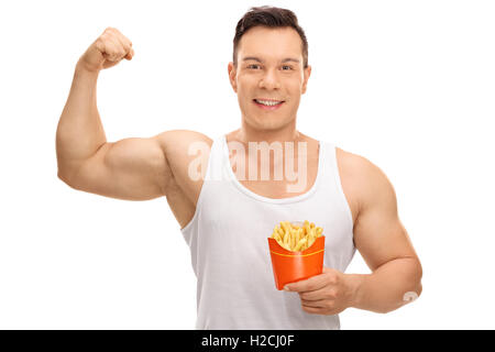 Cheerful guy flexing his bicep and holding a bag of fries isolated on white background Stock Photo