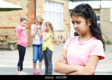 Unhappy Girl Being Gossiped About By School Friends Stock Photo - Alamy