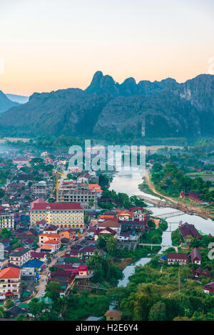 Aerial view of city, Nam Song River and karst mountains, Vang Vieng, Vientiane Province, Laos Stock Photo