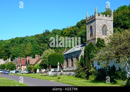 View along the pretty village street with the church in the foreground, Milton Abbas, Dorset, England, UK, Western Europe. Stock Photo