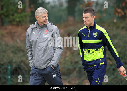 Arsenal manager Arsene Wenger (left) speaks with Arsenal's Laurent Koscielny during a training session at London Colney, London. PRESS ASSOCIATION Photo. Picture date: Tuesday September 27, 2016. See PA story SOCCER Arsenal. Photo credit should read: Adam Davy/PA Wire Stock Photo