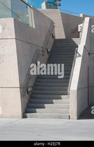 Architectural image of concrete steps leading up from the promenade at Bridlington sea front on a sunny day Stock Photo