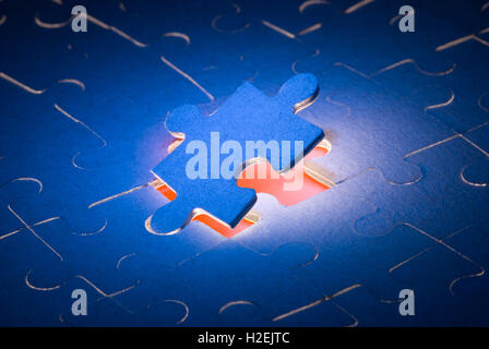 The dark blue puzzles. It is a symbol (the decision of all problems). Stock Photo