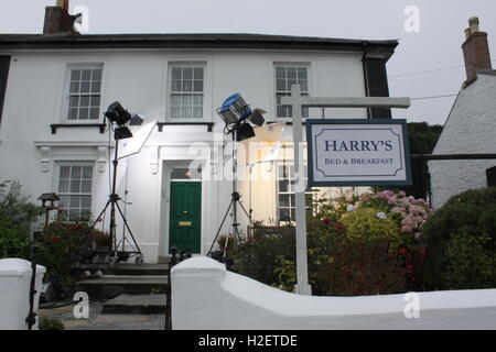 Cornwall, UK. 12th Sep, 2016. The private house in Portscatho, which turns into 'Harry's Bed & Breakfast' in the series, is illuminated by headlights for the production works for the Rosamunde Pilcher series of ZDF television in Cornwall, England, 12 September 2016. PHOTO: PHILIP DETHLEFS/dpa/Alamy Live News Stock Photo