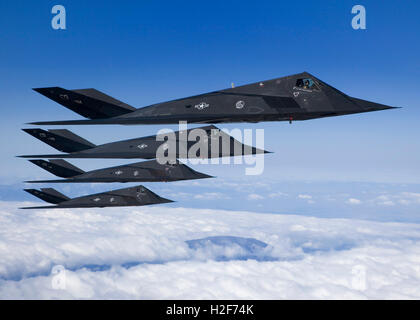 Four U.S Air Force F-117 Nighthawk aircraft fly in formation during a sortie training exercise over Antelope Valley March 28, 2007 in California. Stock Photo