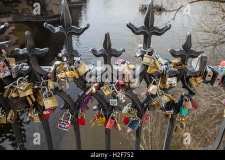 Love locks on railings next to Charles Bridge Prague Stock Photo