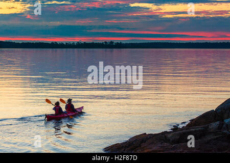 Kayakers off Cattle Point at dawn-Victoria, British Columbia, Canada. Stock Photo