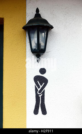 funny mens urinal sign Santa da Serra Madeira Stock Photo