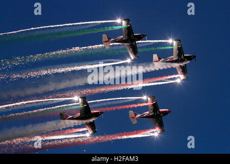 The Pioneer Team flying their Alpi Aviation Pioneer 300 aircraft in a spectacular airshow display at dusk Stock Photo