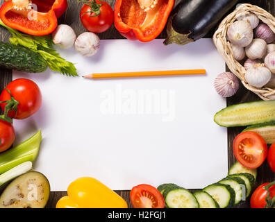 Vegetables tiled around a sheet of paper Stock Photo