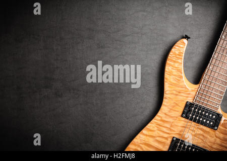 Electric guitar on dark leather background Stock Photo