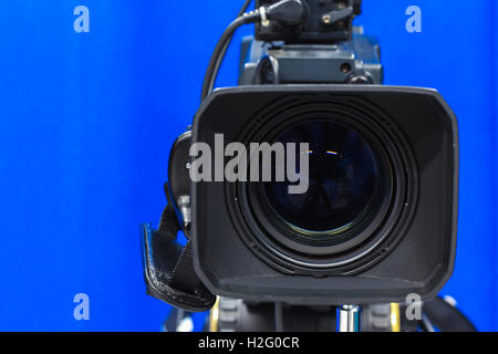 Close up with lens camera on blue screen Stock Photo