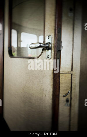 Open door in old retro railway carriage. Vintage transportation. Stock Photo