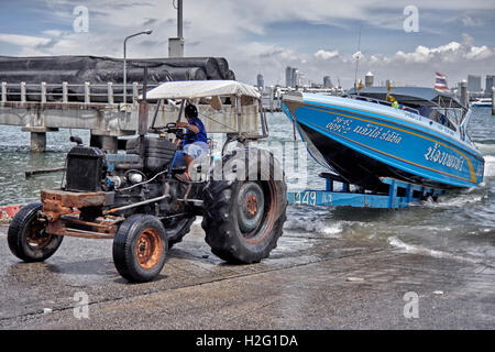 Tractor utiilised to remove boats from the water for dry storage. Thailand S. E. Asia Stock Photo