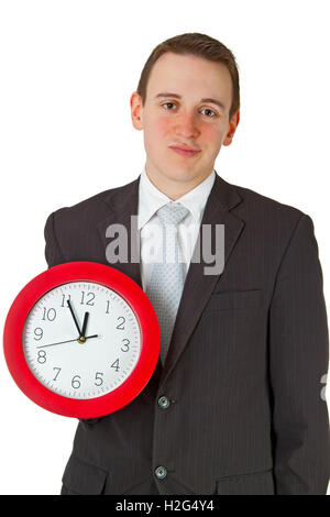 Young businessman, stressed holding a clock. Stock Photo