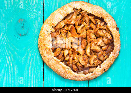 Homemade organic apple pie view from top. Autumn dessert galette with apple, cinnamon, and other spices Stock Photo
