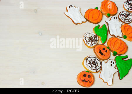 Funny delicious homemade ginger biscuits for Halloween on the table. horizontal view from above Stock Photo