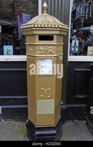 Post box painted gold to commemorate Sophie Well's gold medal in London Olympics 2012.  Lincoln Stock Photo