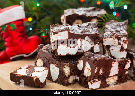 Rocky road crunch bars, christmas dessert made with chocolate,  marshmallow, hazelnut, biscuit and glace cherries Stock Photo