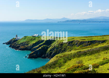 View from Howth Head across Dublin Bay Ireland, over Baily Lighthouse, Dalkey Head and Island to Wicklow Mountains on skyline Stock Photo