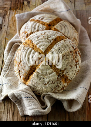 Artisan organic sour dough wholemeal seed bread loaf with white, malted and rye flour Stock Photo