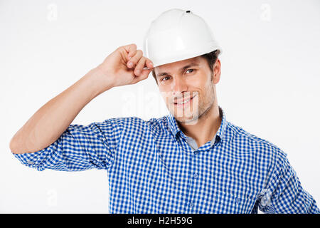Portrait of happy young man architect in building helmet Stock Photo