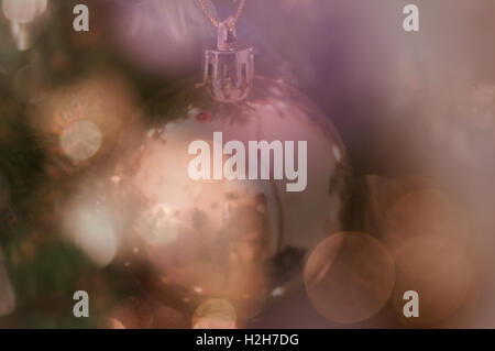 Blurred bokeh Christmas background of bauble and lights. Stock Photo