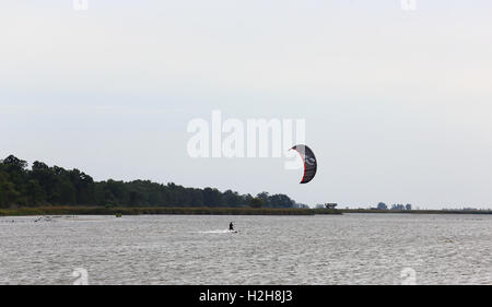 Kite surfing in the evening with back-lighting Stock Photo