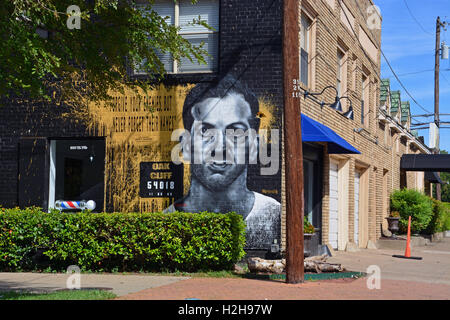 A mural is painted in the Oak Cliff, Bishop Arts District to recall Lee Harvey Oswald and his assassination of John F Kennedy. Stock Photo