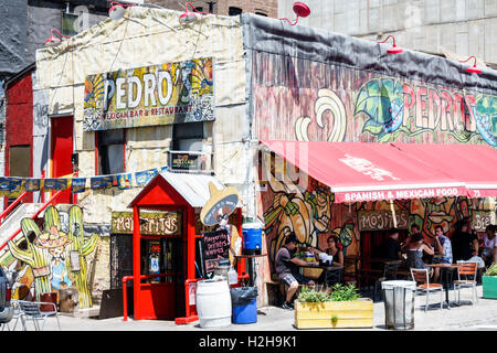 New York City,NY NYC Brooklyn,Dumbo,Front Street,Pedro's Mexican Bar & restaurant,exterior,graffiti art,outside exterior,dining food,sign,wood cutout, Stock Photo