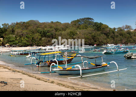 Indonesia, Bali, Padangbai, traditionally painted fishing boats moored in the bay Stock Photo
