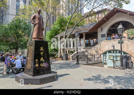 Families of  Chinese Americans in Columbus Park in Chinatown, New York City playing Chinese Chess, also known as, Xiangqi. Stock Photo