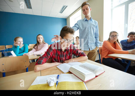 classmate offending student boy at school Stock Photo
