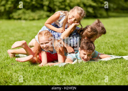 happy kids playing and having fun in summer park Stock Photo