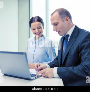 business team with laptop having discussion Stock Photo