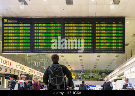 person looking at list flight departures board airport dublin Stock Photo