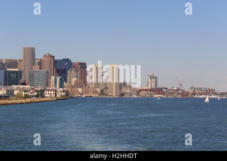 A photograph of the Boston Waterfront, as seen from a boat on Boston Harbor. Stock Photo