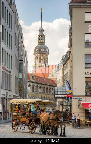 Horse-drawn carriage with tourists in Dresden Stock Photo
