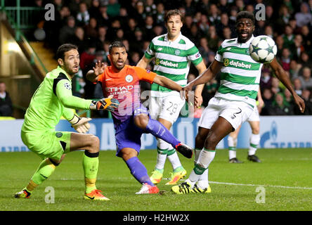Manchester City's Sergio Aguero (centre) and Celtic's Kolo Toure right) battle for the ball during the UEFA Champions League, Group C match at Celtic Park, Glasgow. Stock Photo