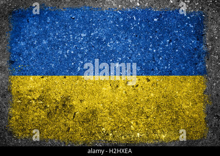 Flag of Ukraine painted on a concrete wall. Stock Photo