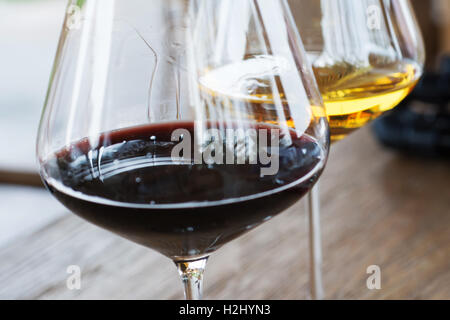 Glasses of Red and White Wine Close Up on Wooden Background Stock Photo