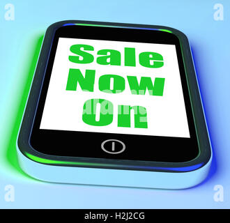 Sale Now On Phone Shows Promotional Savings Or Discounts Stock Photo