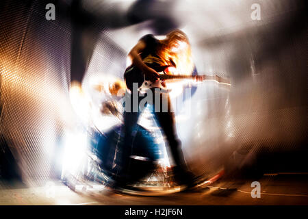 Man playing the guitar.Abstract Live music background concept.Guitar player and rock music concept Stock Photo