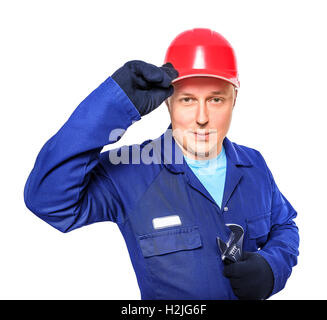 Worker in blue overall with wrench isolated over white background Stock Photo